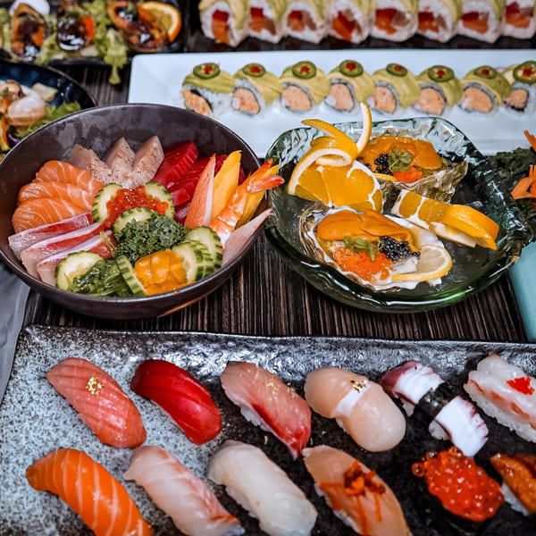 A vibrant spread of Sushiya's sushi, sashimi, and oysters with uni, caviar, and citrus.